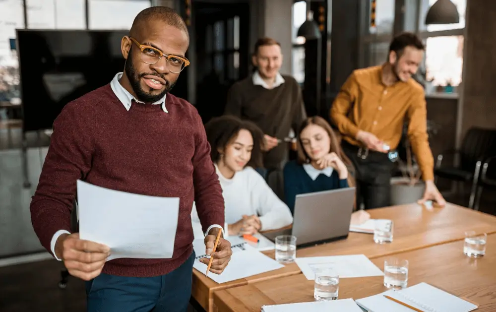 man-holding-paper-at-workplace